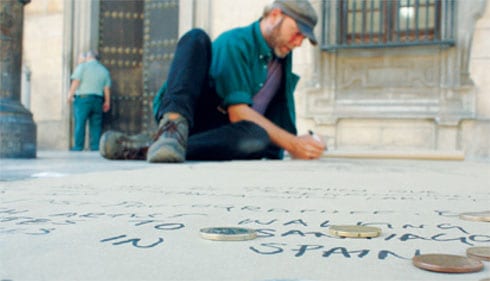 SKETCHING: John Colley works on his pavement art in northern Spain