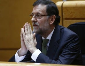 Rajoy praying