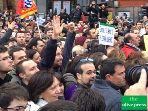PODEMOS: Pablo Iglesias clenched fist salute to the crowd. Copyright: theolivepress.es