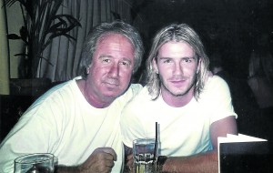 GOLDEN BOYS: Boland, here with David Beckham, was paid €20,000 a month to run REM for Gaspar and Man