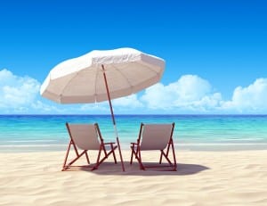 Beach chair and umbrella on sand beach. Concept for rest, relaxation, holidays, spa, resort.