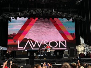 Lawson's lead singer Andy Brown with Gibraltar flag around shoulders
