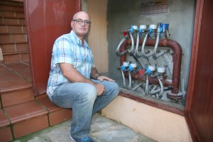 Community president Trevor Walkingshaw inspects pipes Photo: Olive Press Spain