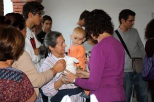 JEREZ: A Spanish mother cradles a young Syrian