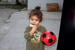 JEREZ: A Syrian child enjoys her toy donation