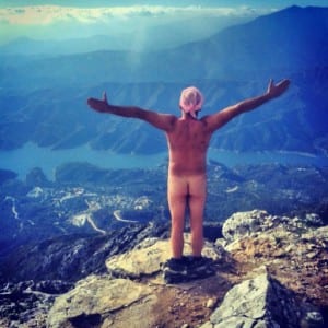 Giles gets naked on the top of La Concha for charity wearing nothing but a pink headscarf 
