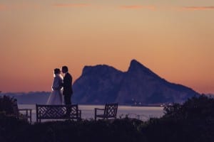 ROCK-SOLID LOVE: Newly weds enjoy a quiet moment in stunning spot overlooking Gibraltar. Photo: Jon Segui