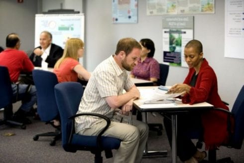 six people working in office e