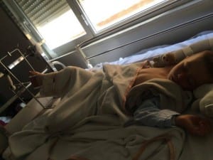 Alfie in his hospital bed