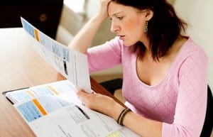 Woman looking at Utility bills