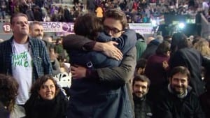 Pablo Iglesias and Inigo Errejon hug after the Podemos votes