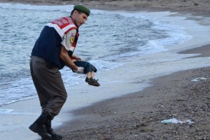 HARROWING: Alan Kurdi being removed from beach 