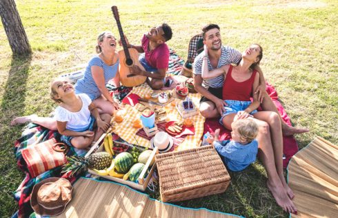 High Angle Top View Of Happy Families Having Fun With Kids At Pic Nic Barbecue Party   Multiracial Love Concept With Mixed Race People Playing With Children At Public Park   Warm Retro Vintage Filter