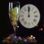 Why do locals in Spain eat 12 grapes to ring in the New Year?