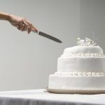 Woman Cutting Wedding Cake