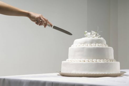 Woman Cutting Wedding Cake