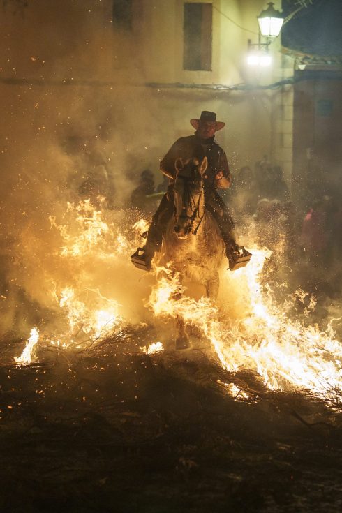 Horses Are Ridden Through Bonfires Duuring The Annual Luminarias Festival In Spain
