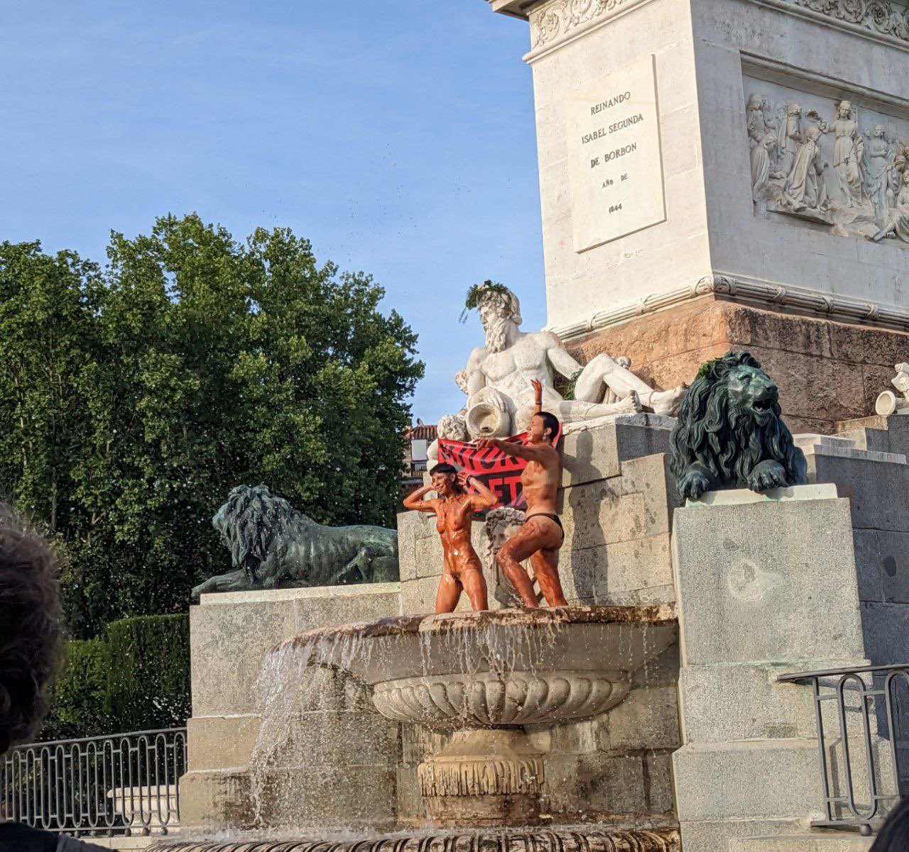 Two climate activists swim naked in front of the Royal Palace in Madrid -  Olive Press News Spain