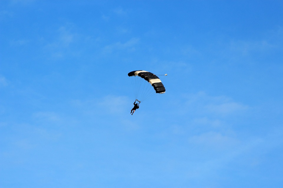 Daredevil parachutist jumps off 100m high tower block in Malaga