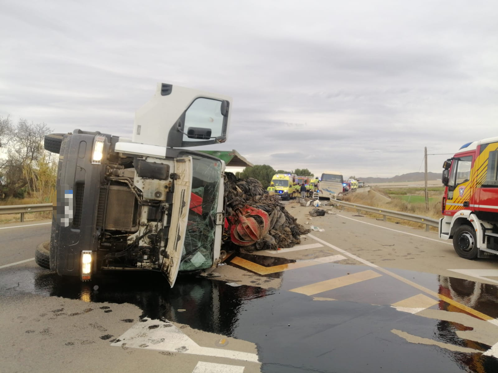 Young woman dead and several injured in Spain's Murcia after lorry crashes into bus and leaves 17 people trapped