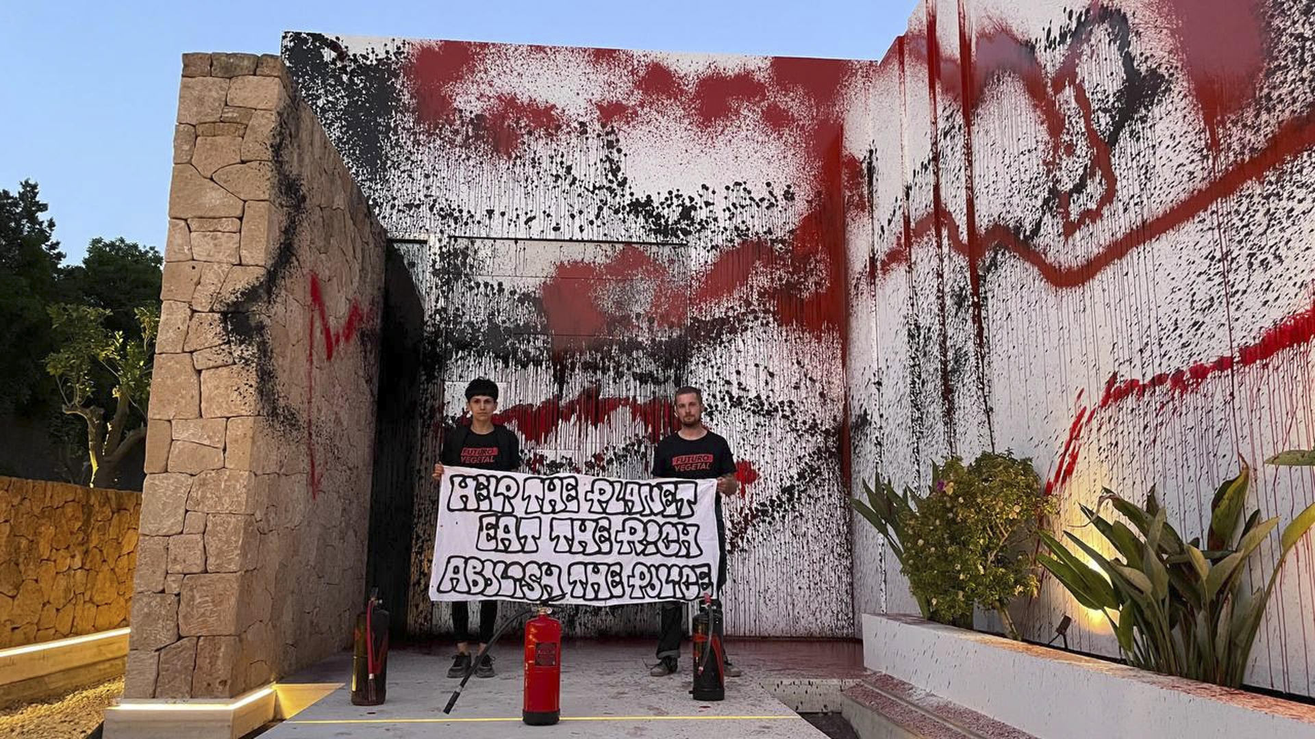 Luxury Ibiza mansion owned by soccer star Lionel Messi is invaded by climate change activists who daub paint on a wall