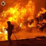 IN PICS: Graveyard for flood-destroyed vehicles in Valencia catches fire with huge plumes of toxic smoke