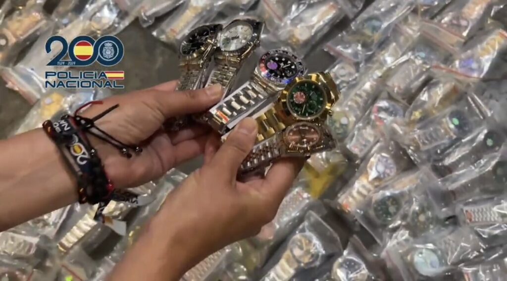 WATCH: Police in Spain bust importers of 2,000 tons of counterfeit sports shirts, watches, and phones shipped from China