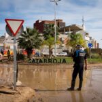 Wife of missing DANA victim searches for last known photo of her husband showing him clinging onto pole during deadly Valencia floods